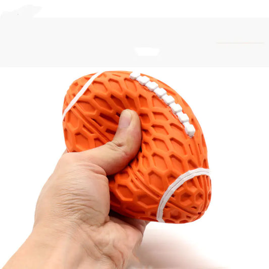 Durable Dog Toy for Boredom Relief and Playtime, Hand holding an orange textured ball with white accents on a white background